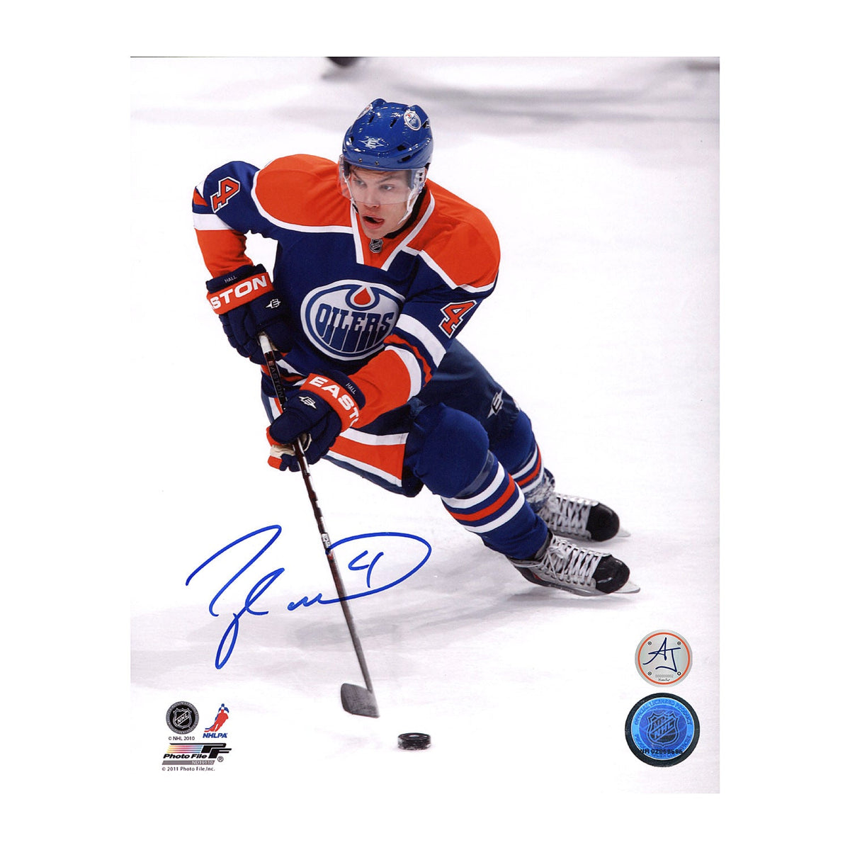 Taylor Hall Signed Edmonton Oilers Puck Control 8x10 Photo product image 1, provided for visual reference and product detail