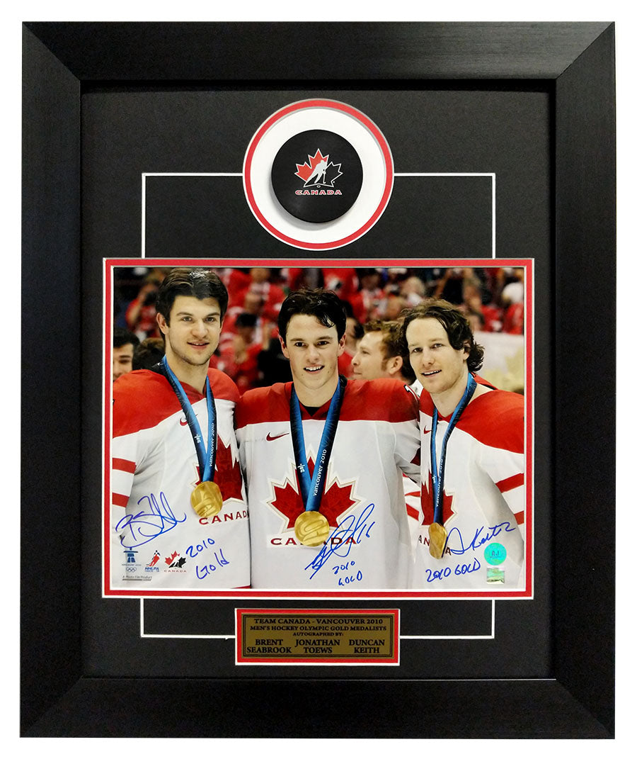 Toews, Keith & Seabrook Triple Signed Blackhawks Canada 2010 Gold 20x24 Frame product image 1, provided for visual reference